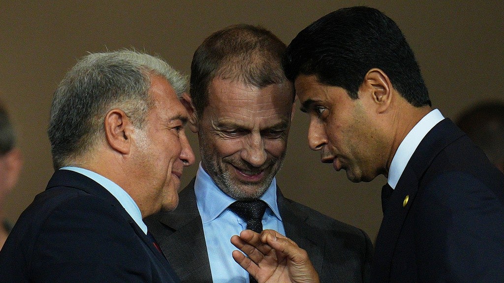 AP : UEFA president Aleksander Ceferin, centre, FC Barcelona president Joan Laporta, left, and PSG president Nasser Al-Khelaifi speak before the Champions League opening phase match between Barcelona and Paris Saint-Germain at the Lluis Companys Olympic Stadium.