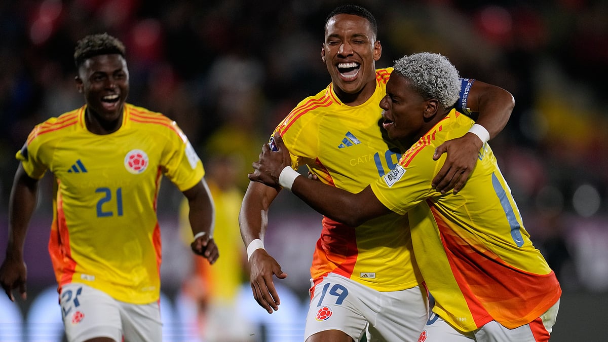| Photo: AP/Matias Delacroix : Colombia's Kener Gonzalez celebrates with Colombia's Oscar Perea after scoring his side's opening goal against Nigeria during a FIFA U-20 World Cup Group F soccer match at Fiscal Stadium in Talca, Chile, Sunday, Oct. 5, 2025.