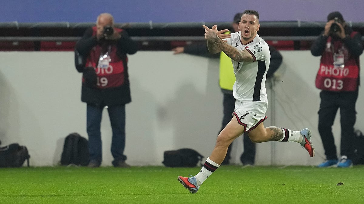 | Photo: AP/Darko Vojinovic : Albania's Rey Manaj celebrates after scoring his side's opening goal during the World Cup Group K qualifying soccer match between Serbia and Albania, at the Dubocica Stadium in Leskovac, Serbia, Saturday, Oct. 11, 2025. 