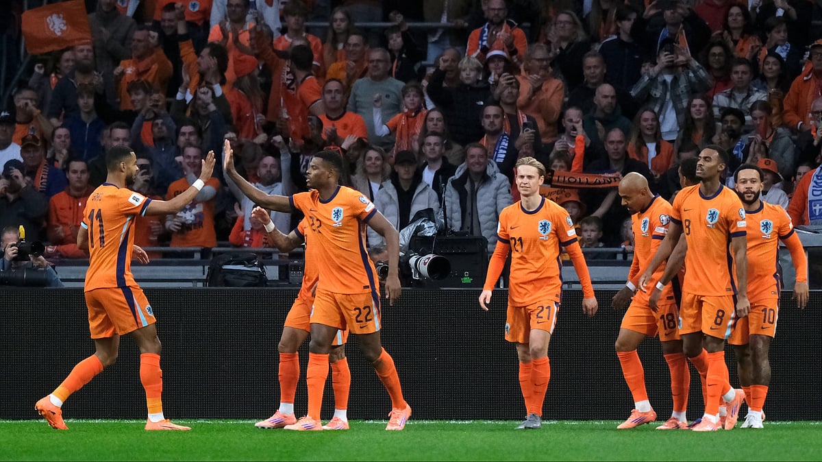 | Photo: AP/Patrick Post : The Netherlands players celebrate after Donyell Malen, 3rd right, scored the opening goal during a World Cup 2026 group G qualifying soccer match between the Netherlands and Finland in Amsterdam, Sunday, Oct. 12, 2025. 