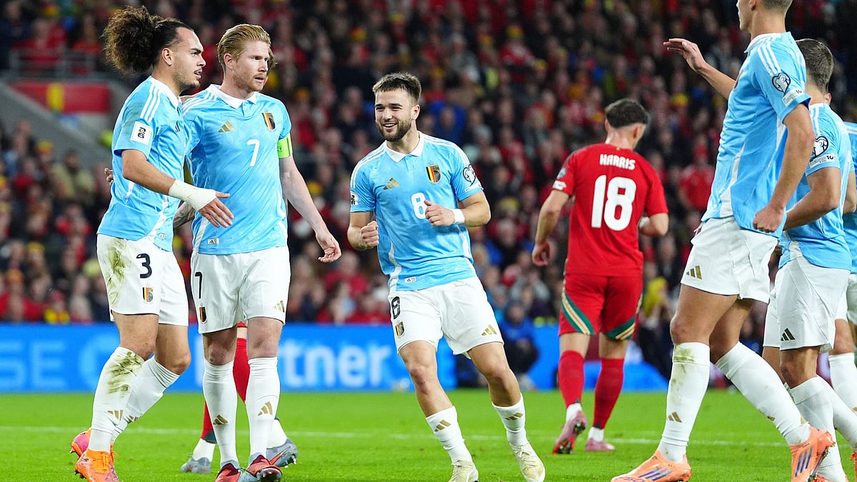 | Photo: AP/David Davies : Belgium's Kevin De Bruyne, second left, celebrates scoring their side's first goal of the game from a penalty during the World Cup European Qualifying soccer match between Wales and Belgium at the Cardiff City Stadium in Cardiff, Monday, Oct. 13, 2025.