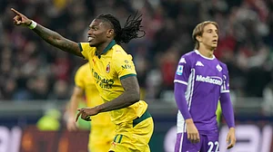 AP/Luca Bruno : Rafael Leao celebrates scoring his side's first goal during a Serie A soccer match between AC Milan and Fiorentina in Milan, Italy, Sunday.