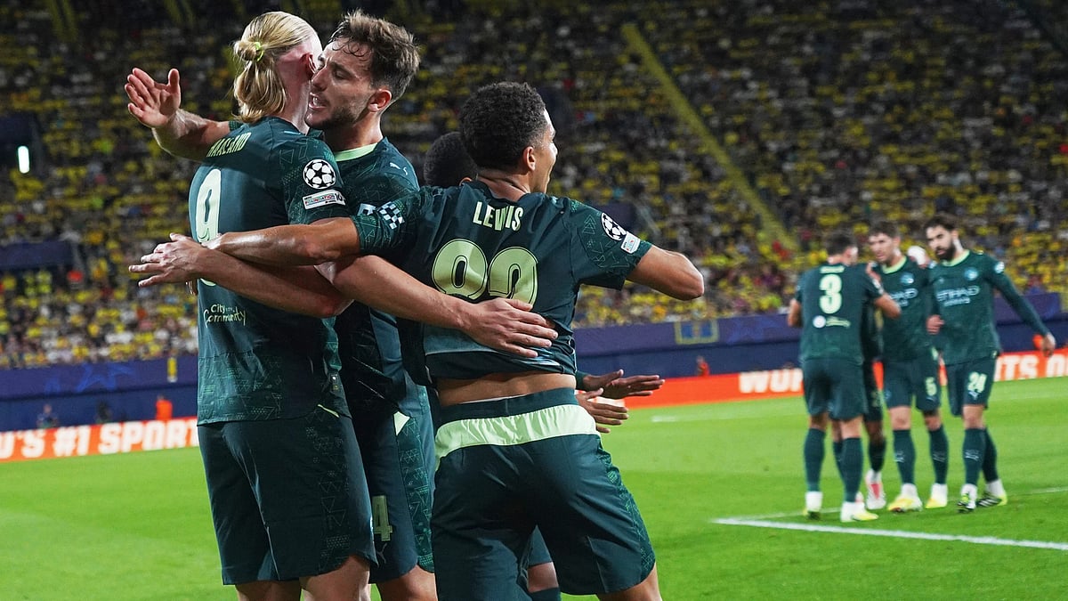 | Photo: AP/Alberto Saiz : Manchester City's Erling Haaland, left, celebrates with teammates after scoring his side's opening goal during the Champions League opening phase soccer match between Villarreal and Manchester City in Villarreal, Spain, Tuesday, Oct. 21, 2025.