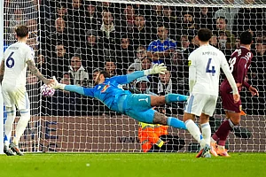 | Photo: Danny Lawson/PA via AP : Leeds United's goalkeeper Lucas Perri dives in vain as West Ham United's Mateus Fernandes, right, scores their side's first goal during the English Premier League soccer match between Leeds United and West Ham United at Elland Road, Leeds, England.