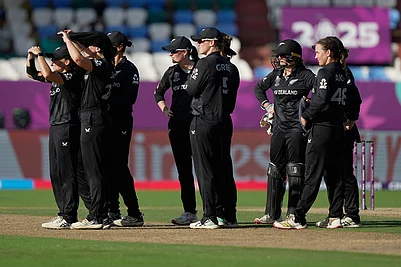 | Photo: AP/Mahesh Kumar A. : New Zealands players wait for the third umpires review for the wicket of Englands Amy Jones during the ICC Womens Cricket World Cup match between England and New Zealand at ACA–VDCA Cricket Stadium in Visakhapatnam.