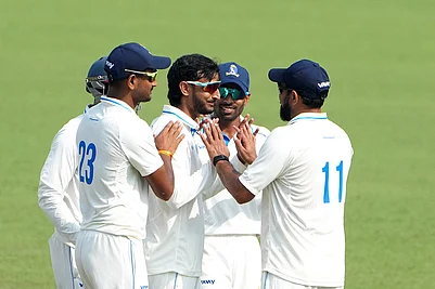 | Photo: PTI/Swapan Mahapatra : Bengals Shahbaz Ahmed celebrates with teammates after dismissing Gujarats Chintan Gaja on Day 3 of the Ranji Trophy match at Eden Gardens, Kolkata.