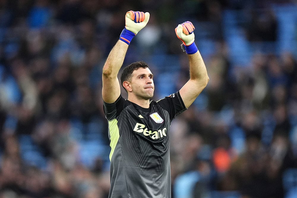 | Photo: Mike Egerton/PA via AP : Aston Villa goalkeeper Emiliano Martinez celebrates in front of the fans following victory in the English Premier League match between Aston Villa and Manchester City, in Birmingham, England.