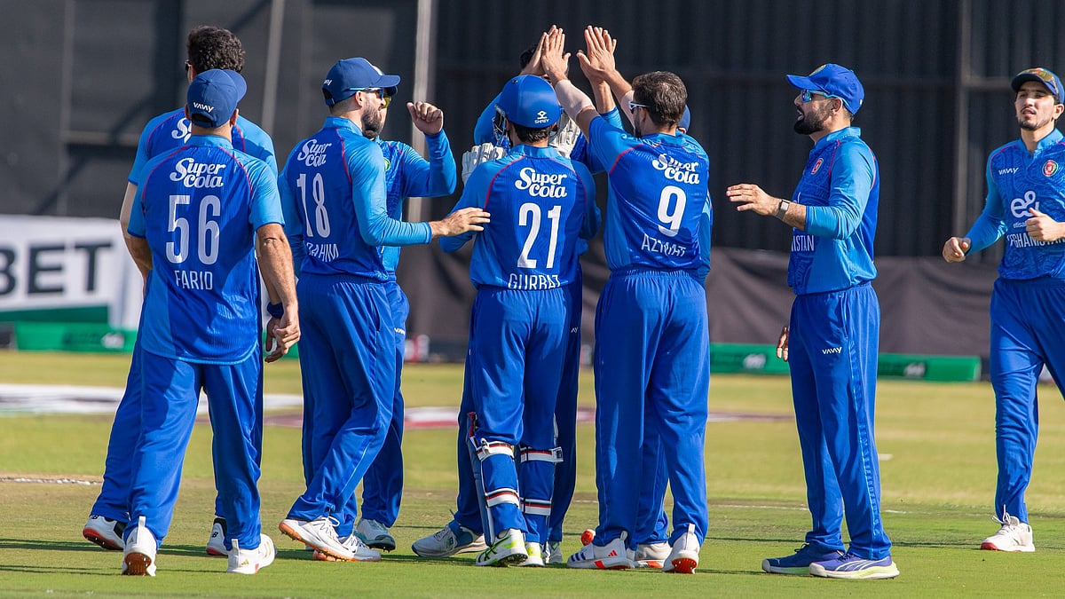 X/Afghanistan Cricket Board : Afghanistan celebrate a West Indies wicket in a T20I match in Harare.
