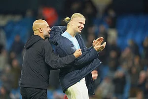 | Photo: AP/Ian Hodgson : Manchester City's head coach Pep Guardiola, left, celebrates with Erling Haaland after the English Premier League soccer match between Manchester City and Bournemouth in Manchester, England.