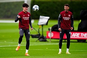| Photo: Bradley Collyer/PA via AP : Arsenal's Christian Norgaard, left, during a training session in London, England, ahead of the Champions League soccer match against Slavia Praha.