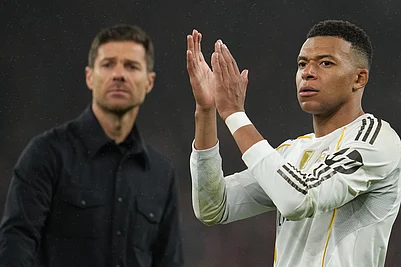 | Photo: AP/Jon Super : Real Madrids head coach Xabi Alonso and Kylian Mbappe walk off the oitch after the Champions League soccer match between Liverpool and Real Madrid in Liverpool, England.