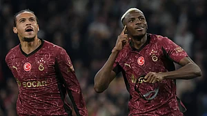 (AP Photo/Patrick Post) : Galatasaray's Leroy Sane, left, and Victor Osimhen celebrate after a goal during the Champions League between Ajax and Galatasaray in Amsterdam, Netherlands, Wednesday, Nov. 5, 2025.