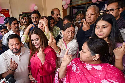 | Photo: PTI : RJD leader and Leader of Opposition in Bihar Assembly Tejashwi Yadav and his wife Rajshree Yadav, party leaders and former Bihar chief ministers Lalu Prasad Yadav and Rabri Devi, party MP Misa Bharti and others show their fingers marked with indelible ink after casting votes at a polling station during the first phase of Bihar Assembly elections, in Patna.