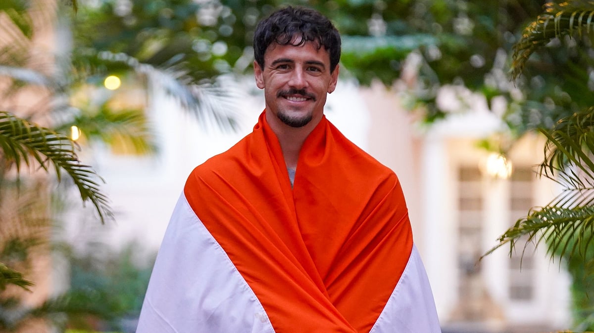 | Photo: X/bengalurufc : Bengaluru FC player Ryan Williams with the Indian flag.