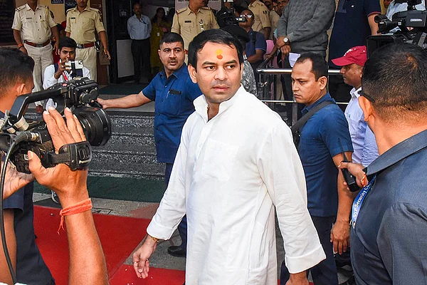 | Photo: PTI : Janshakti Janata Dal (JJD) chief Tej Pratap Yadav arrives at a polling station to cast his vote during the first phase of the Bihar Assembly elections, in Patna.