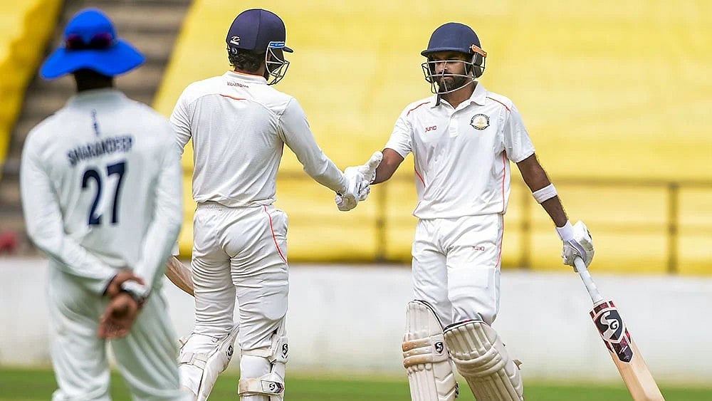 Photo: PTI : Vidarbhas Ravikumar Samarth being congratulated on his half century on the fourth and last day of the Ranji Trophy 2025-26 cricket match between Vidarbha and Jharkhand, in Nagpur, Maharashtra