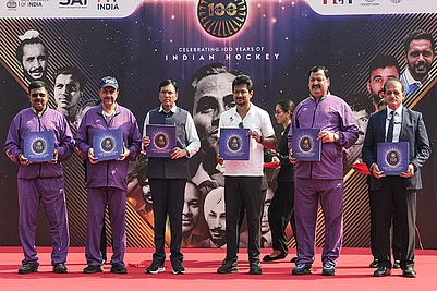 | Photo: PTI/Atul Yadav : Union Minister for Sports Mansukh Mandaviya with Tamil Nadu Deputy Chief Minister Udhayanidhi Stalin and others releases a book during the Hockey India centenary celebrations, at Major Dhyan Chand National Stadium, in New Delhi.