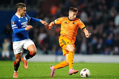 | Photo: Jane Barlow/PA via AP : Rangers Max Aarons, left, and Romas Stephan El Shaarawy in action during the Europa League soccer match between Rangers and Roma in Glasgow, Scotland.
