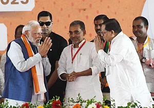 IMAGO - Hindustan Times : Prime Minister Narendra Modi with Rashtriya Lok Morcha president Upendra Kushwaha and chairman of Bihar Legislative Council Awadhesh Narayan Singh during a public rally in support of NDA candidates ahead of Bihar Assembly Elections 2025 on November 2, 2025 in Ara, India. Modi’s roadshow drew an overwhelming response from women, many of whom described the Prime Minister as a leader who transformed their lives through welfare schemes and social empowerment initiatives.