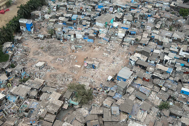 shutterstock : MUMBAI-INDIA - April 10, 2021: Aerial view of demolish slum to upgrade through slum rehabilitation project at Mahim.