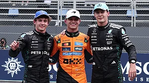 Photo: AP : Sao Paulo Grand Prix F1 Sprint Highlights: McLaren driver Lando Norris, centre, Mercedes' Kimi Antonelli, left, and Mercedes' George Russell celebrate after finishing on the podium.
