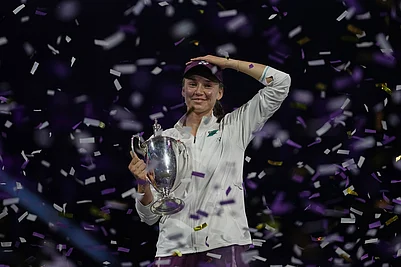 | Photo: AP/Fatima Shbair : Elena Rybakina of Kazakhstan celebrates with her trophy after defeating Aryna Sabalenka of Belarus in the womens final singles match of the WTA finals in Riyadh, Saudi Arabia.