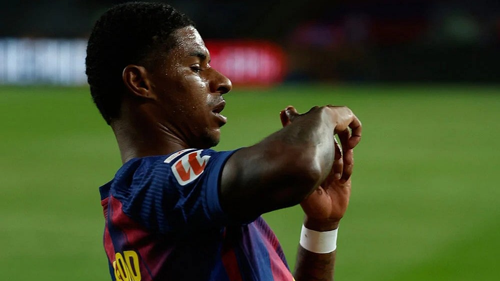 Photo: AP/Joan Monfort : Barcelona's Marcus Rashford celebrates after scoring his side's third goal during a Spanish La Liga soccer match between FC Barcelona and Elche CF in Barcelona, Spain.