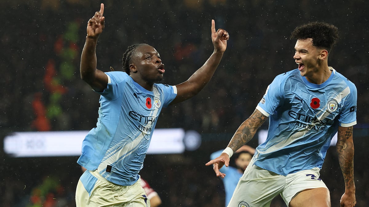 Jeremy Doku celebrates after scoring Manchester City's third goal