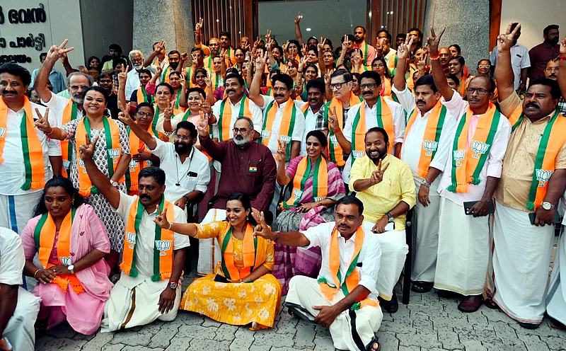 PTI : BJP President Rajeev Chandrasekhar poses for a photograph with all BJP candidates contesting the upcoming Kerala local body elections