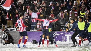 Spencer Colby/The Canadian Press via AP : Atletico Ottawa's David Rodriguez (7) celebrates his with teammates and Atletico fans during the Canadian Premier League final against Cavalry FC.