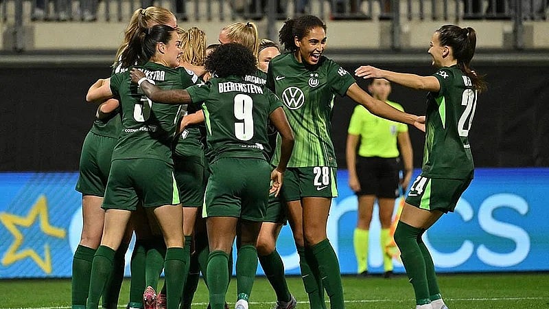 Swen Pfortner/dpa via AP : VfL Wolfsburg players celebrate after Paris St. Germain's Jackie Groenen scored an own goal during a Women's Champions League match in Wolfsburg, Germany.