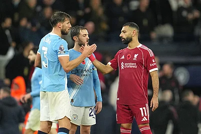 | Photo: AP/Jon Super : Manchester Citys Ruben Dias, left, Manchester Citys Bernardo Silva, centre, Liverpools Mohamed Salah after the English Premier League soccer match between Manchester City and Liverpool in Manchester, England.