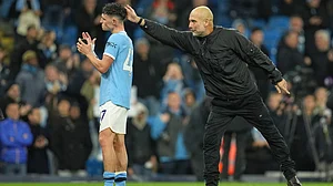 | Photo: AP/Jon Super : Manchester City's head coach Pep Guardiola celebrates with Phil Foden at the end of the English Premier League match against Liverpool on Sunday, November 9, 2025