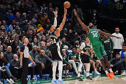 | Photo: AP/LM Otero : Milwaukee Bucks forward Giannis Antetokounmpo (34) shoots a three-pointer against Dallas Mavericks center Moussa Cisse (30) during the second half of an NBA basketball game in Dallas.