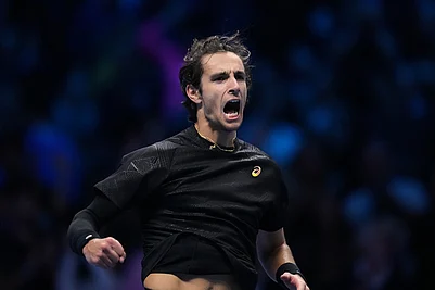 | Photo: AP/Antonio Calanni : Italys Lorenzo Musetti celebrates after winning against Australias Alex de Minaur during their tennis match of the ATP World Tour Finals, in Turin, Italy.