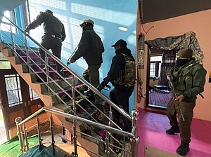 - : Kulgam: Security personnel during a crackdown against the banned organisation Jamaat-e-Islami (JeI), in Kulgam, Jammu and Kashmir, Wednesday, Nov. 12, 2025.