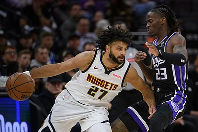 | Photo: AP/Randall Benton : Denver Nuggets guard Jamal Murray (27) drives past Sacramento Kings guard Keon Ellis (23) during the second half of an NBA basketball game in Sacramento, California.