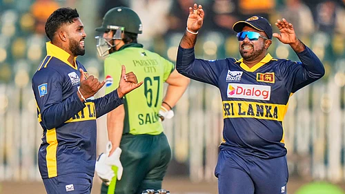 | Photo: AP/Anjum Naveed : Sri Lankas Wanindu Hasaranga celebrates with teammate after the dismissal of Pakistans Babar Azam during the first ODI match in Rawalpindi on Tuesday, November 11, 2025.