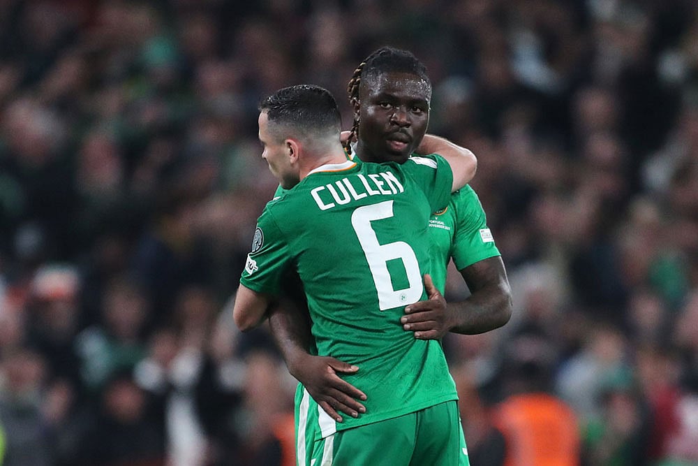 | Photo: AP/Peter Morrison : Ireland's Festy Ebosele and Ireland's Josh Cullen celebrate at the end of a World Cup 2026 group F qualifying soccer match between Ireland and Portugal in Dublin.