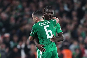 | Photo: AP/Peter Morrison : Ireland's Festy Ebosele and Ireland's Josh Cullen celebrate at the end of a World Cup 2026 group F qualifying soccer match between Ireland and Portugal in Dublin.