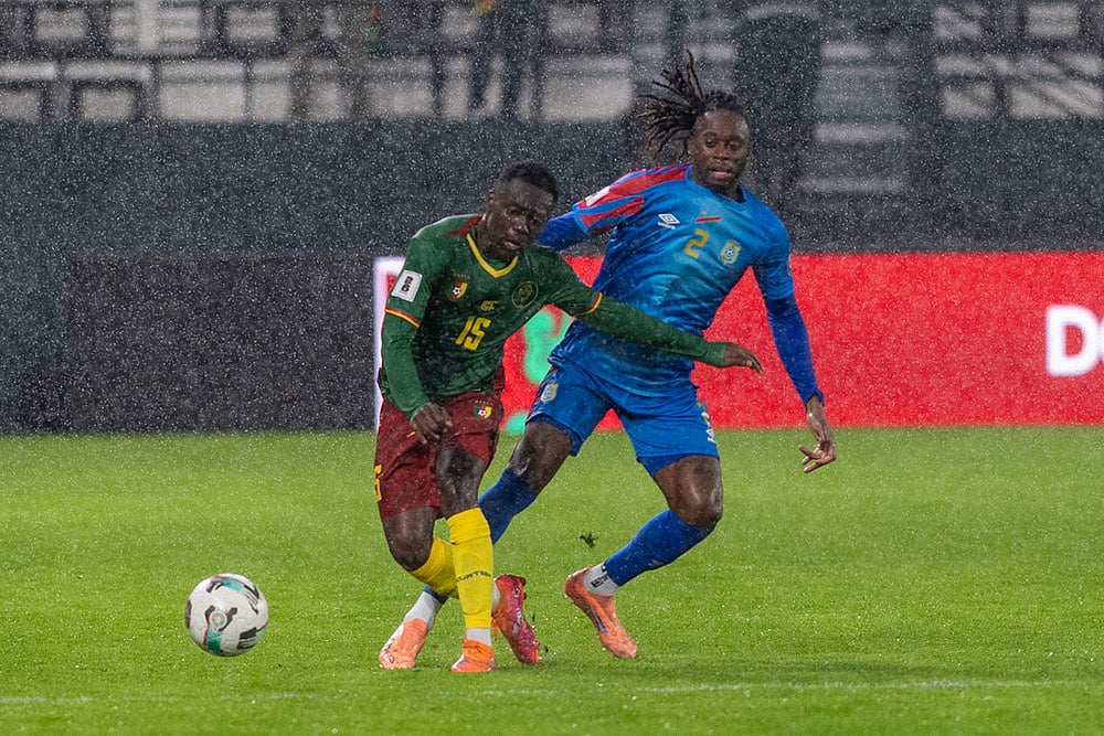 | Photo: AP : Congo's Aaron Wan-Bissaka challenges Cameroon's Arthur Avom Ebong during their FIFA 2026 soccer World Cup African qualifiers semi final, in Rabat, Morocco.