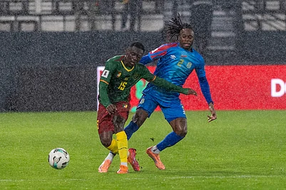 | Photo: AP : Congos Aaron Wan-Bissaka challenges Cameroons Arthur Avom Ebong during their FIFA 2026 soccer World Cup African qualifiers semi final, in Rabat, Morocco.