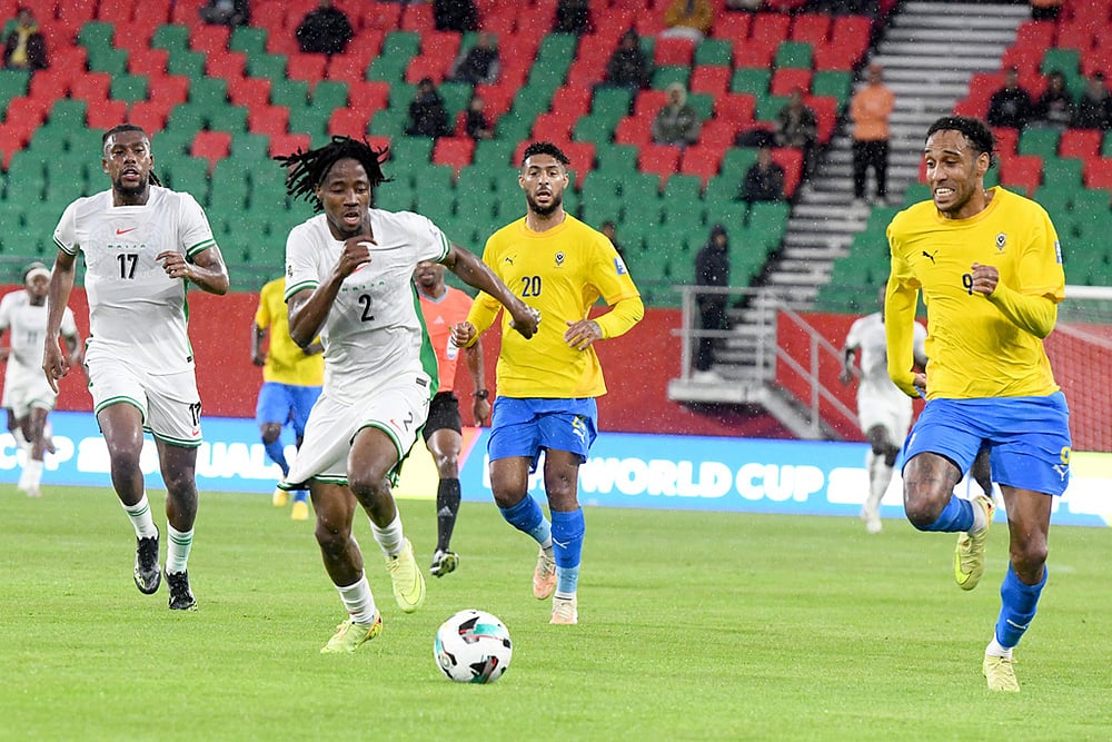 | Photo: AP : Nigeria's Benjamin Fredrick, centre left, and Gabon's Pierre-Emerick Aubameyang, right, challenge for the ball during the World Cup 2026 African qualifying semi-final soccer match between Nigeria and Gabon, in Rabat, Morocco.
