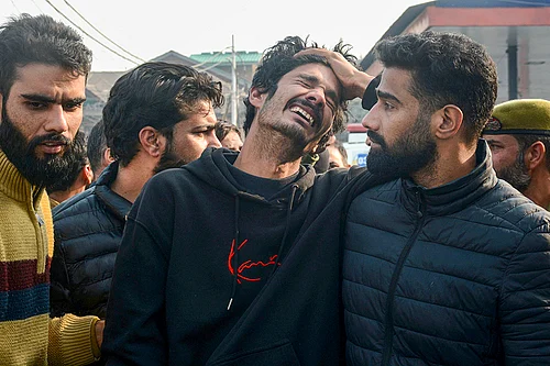 | Photo: PTI : Bereaved family members of the nine persons killed in the accidental blast at Nowgam police station mourn during their tribute ceremony at the Police Control Room, in Srinagar.