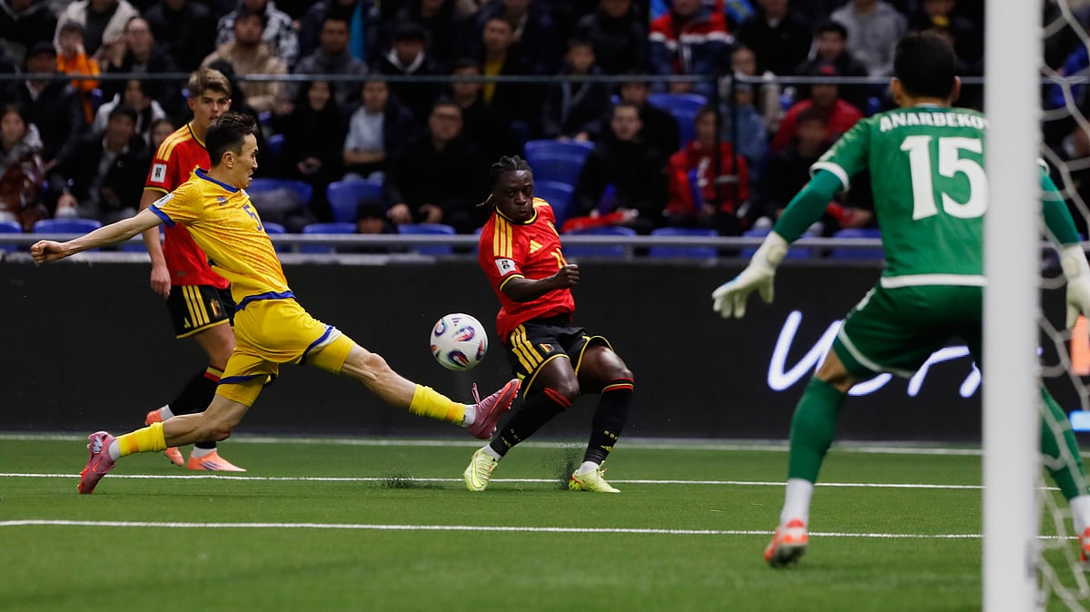 | Photo: AP/ : Kazakhstan's Islambek Kuat and Belgium's Jeremy Doku challenge for the ball during the 2026 World Cup group J qualifying match in Astana on Saturday, November 15, 2025.