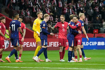 | Photo: AP/Czarek Sokolowski : The Netherlands and Poland players shake hands at the end of a World Cup 2026 group G qualifying soccer match between Poland and the Netherlands in Warsaw.