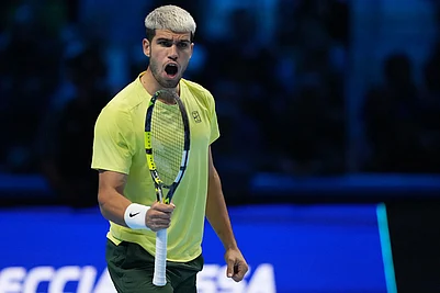 | Photo: AP/Antonio Calanni : Spains Carlos Alcaraz celebrates after winning semifinal tennis match of the ATP World Tour Finals against Canadas Felix Auger-Aliassime, in Turin, Italy.