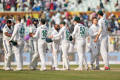 | Photo: AP/Aijaz Rahi : Players of the two teams greet each other after South Africa won the first cricket test match against India in Kolkata, India.
