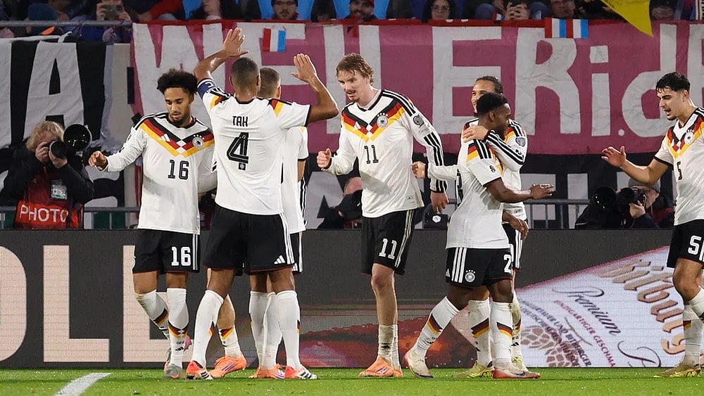 | Photo: AP/Geert Vanden Wijngaert : Germany's Nick Woltemade, center, is congratulated after scoring his sides second goal during the 2026 World Cup group A qualifying soccer match between Luxembourg and Germany in Luxembourg.