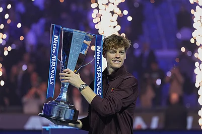| Photo: AP/Antonio Calanni : Italys Jannik Sinner holds the trophy after winning the final tennis match of the ATP World Tour Finals against Spains Carlos Alcaraz in Turin, Italy.